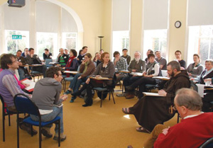 Father Richard participates in a theological discussion group with the Student Christian Movement.