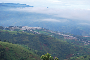 The beauty of the Congolese countryside gives little evidence of the harshness of life within a refugee camp.