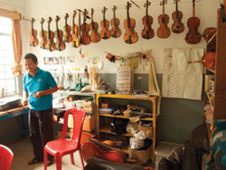 Violins in a Gandhi Ashram School classroom.