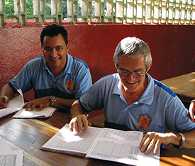 Brother Lucas Favreau, S.C. and Brother José Roberto, S.C., who is visiting from Brazil, plan the school year together.