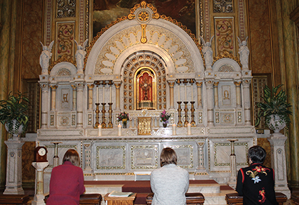 Pictured in eucharistic adoration are Sisters Sarah Hennessy, Walsh, and Eileen McKenzie, F.S.P.A. 