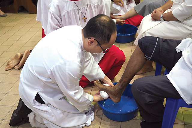 Priests washing feet.