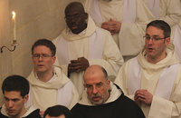 The community sings as they process out of church