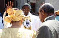 Father Michael K. Okechukwu, S.S.J. blesses a couple at his 2011 ordination