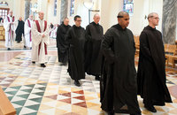 The Benedictine community processes into church