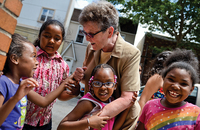 Sister Tesa Fitzgerald, C.S.J. talks to kids from Hour Children foster care home