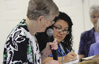 Sister Ann Petrus, C.D.P., superior general of the Congregation of Divine Providence (left), welcomes Sister Christina Chavez, C.D.P. as a member in July 2016. 