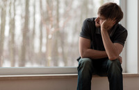 Young man sitting and thinking