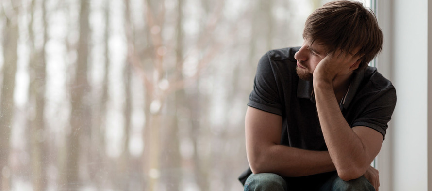 Young man sitting and thinking