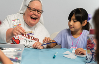 Children make butterflies for an art project with Sister Theresa Jones, F.M.A. 