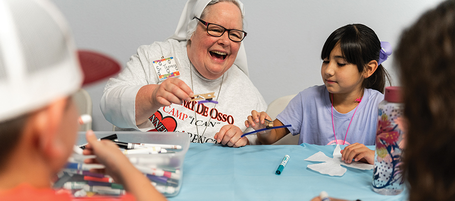 Children make butterflies for an art project with Sister Theresa Jones, F.M.A. 