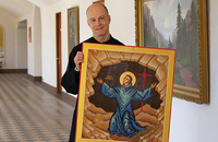 Father Michael Shrum, O.S.B. with the icon he created of Saint Benedict.